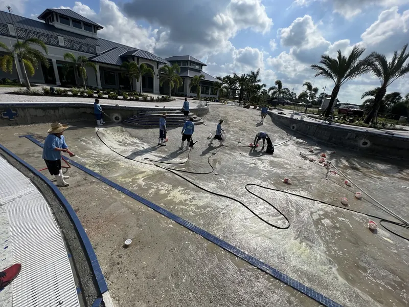 Signet crew hand-troweling the interior finish of a commercial pool